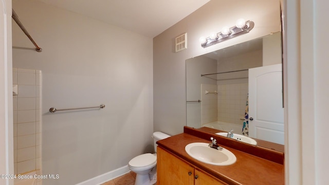 full bathroom featuring vanity, toilet, tile patterned floors, and tiled shower / bath