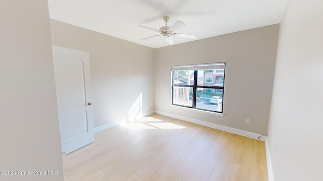 unfurnished room featuring light wood-type flooring and ceiling fan