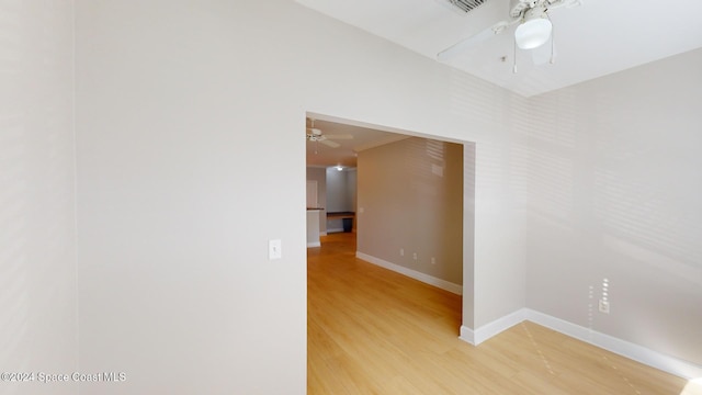 unfurnished room featuring ceiling fan and hardwood / wood-style floors