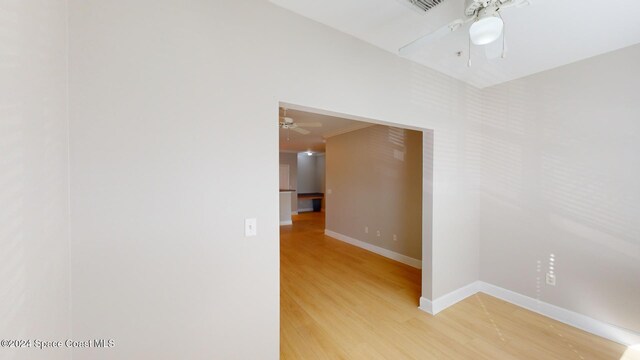 6461 Borasco Dr Unit 2805, Melbourne, FL 32940 - empty room with ceiling fan, light wood finished floors, and baseboards