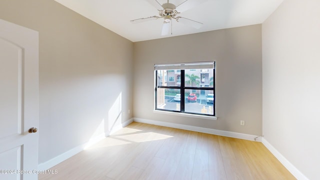 unfurnished room featuring light hardwood / wood-style flooring and ceiling fan