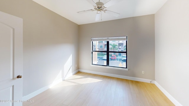 6461 Borasco Dr Unit 2805, Melbourne, FL 32940 - spare room featuring light wood-type flooring, a ceiling fan, and baseboards