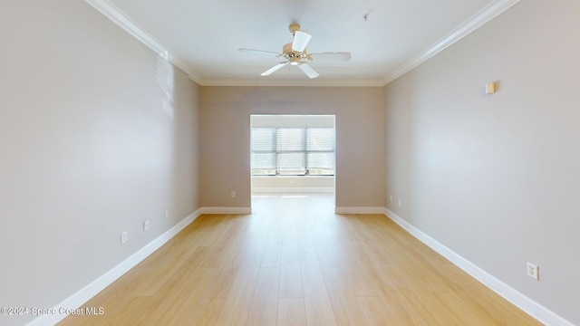 spare room with ornamental molding, light hardwood / wood-style flooring, and ceiling fan