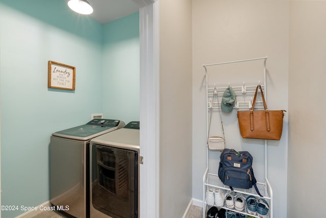 laundry room with washing machine and clothes dryer