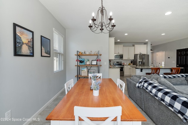 dining area featuring a notable chandelier