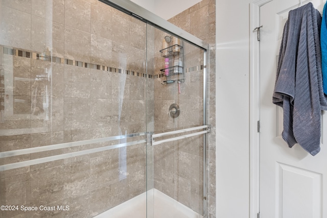 bathroom featuring an enclosed shower