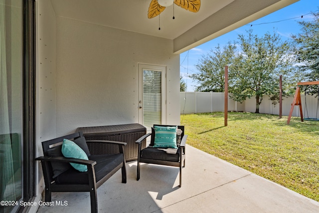 view of patio / terrace featuring ceiling fan