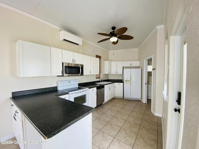 kitchen with a wall mounted AC, sink, stainless steel appliances, and white cabinets