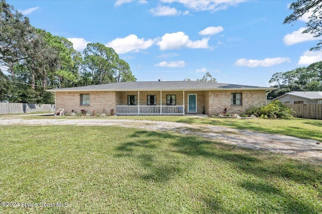 view of front facade featuring a front yard and a porch