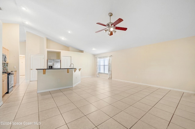 unfurnished living room with ceiling fan, light tile patterned flooring, and high vaulted ceiling