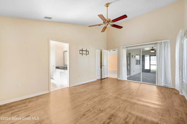 interior space with high vaulted ceiling and light wood-type flooring