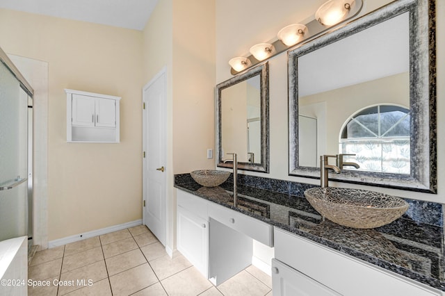 bathroom featuring tile patterned floors, vanity, and an enclosed shower