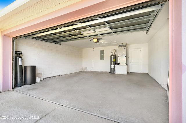 garage with electric water heater, electric panel, a garage door opener, and heating unit