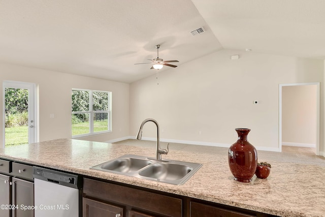 kitchen featuring vaulted ceiling, sink, dark brown cabinetry, and dishwasher