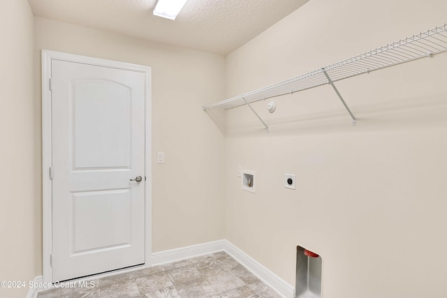 laundry area with washer hookup, a textured ceiling, and hookup for an electric dryer