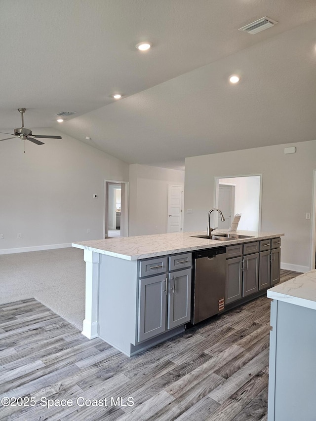 713 Degroodt Rd SW, Palm Bay, FL 32908 - kitchen featuring dishwasher, a sink, vaulted ceiling, a ceiling fan, and an island with sink