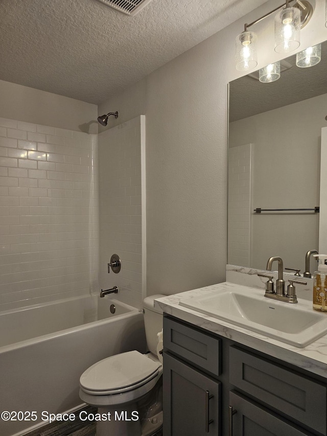 713 Degroodt Rd SW, Palm Bay, FL 32908 - full bathroom featuring toilet, a textured ceiling, vanity, and bathing tub / shower combination