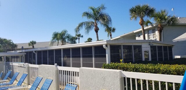 981 Sonesta Ave NE Unit 203, Palm Bay, FL 32905 - exterior space with a sunroom and stucco siding