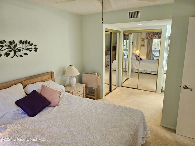 981 Sonesta Ave NE Unit 203, Palm Bay, FL 32905 - bedroom featuring multiple closets, visible vents, and carpet