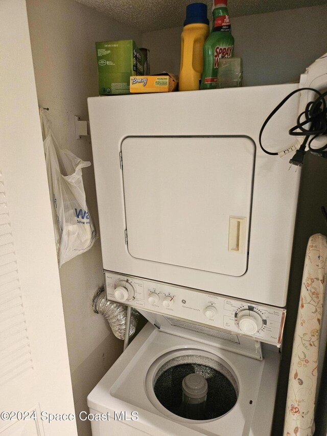 981 Sonesta Ave NE Unit 203, Palm Bay, FL 32905 - laundry area featuring laundry area and stacked washer / dryer