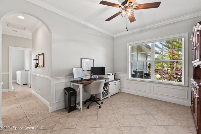 tiled office space with ornamental molding and ceiling fan