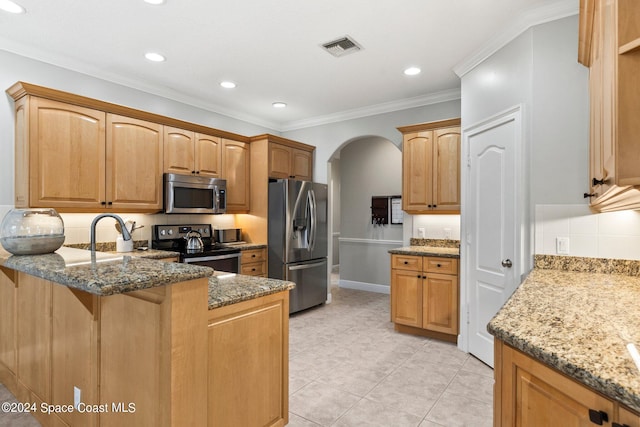 kitchen with kitchen peninsula, light tile patterned floors, stone counters, crown molding, and stainless steel appliances