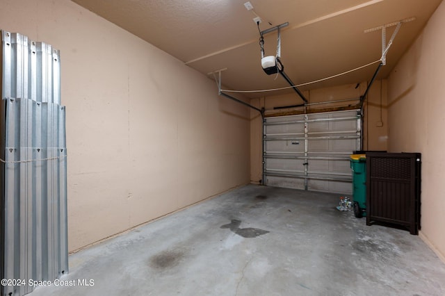 garage featuring a garage door opener