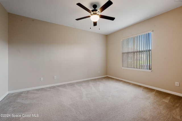 unfurnished room featuring carpet flooring and ceiling fan