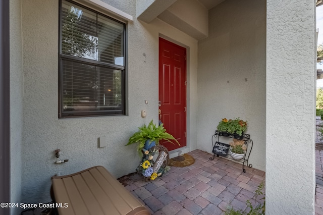 property entrance with a patio