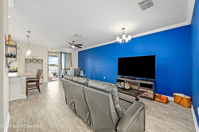 living room with ceiling fan with notable chandelier, crown molding, and light hardwood / wood-style flooring