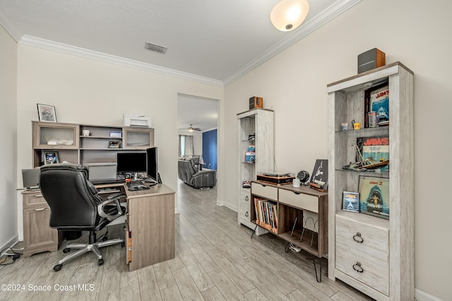 home office with ceiling fan, light hardwood / wood-style flooring, and ornamental molding