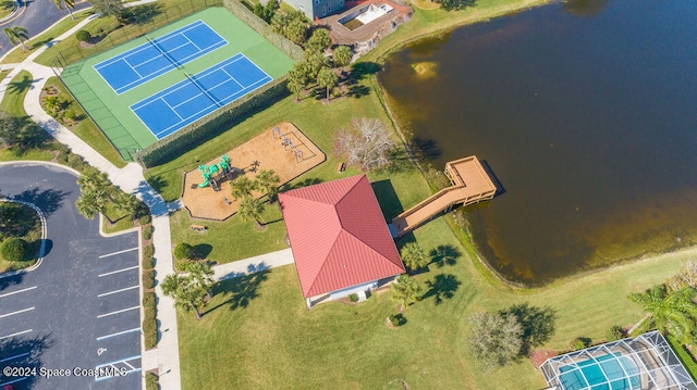 birds eye view of property with a water view