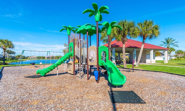 view of jungle gym featuring a water view