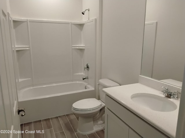 full bathroom with vanity, hardwood / wood-style flooring, toilet, and shower / bathtub combination