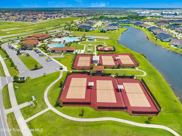 drone / aerial view featuring a water view and a residential view