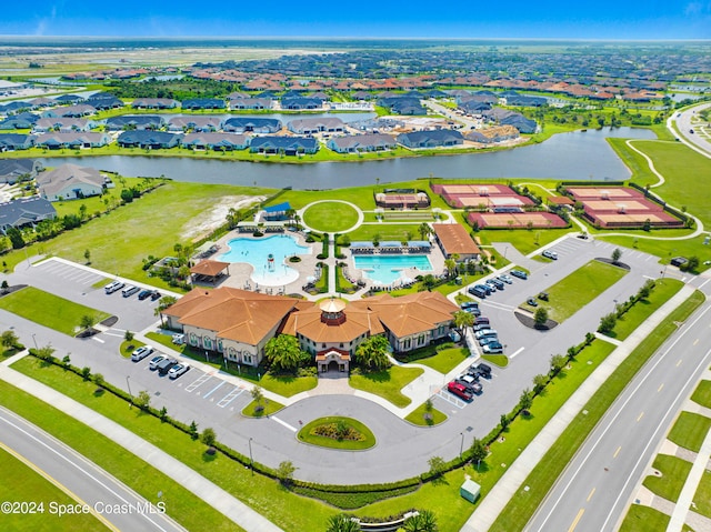 birds eye view of property with a residential view and a water view