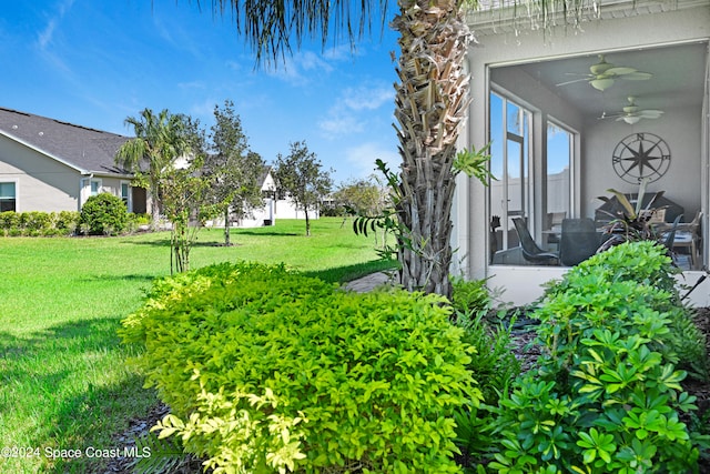 view of yard featuring ceiling fan