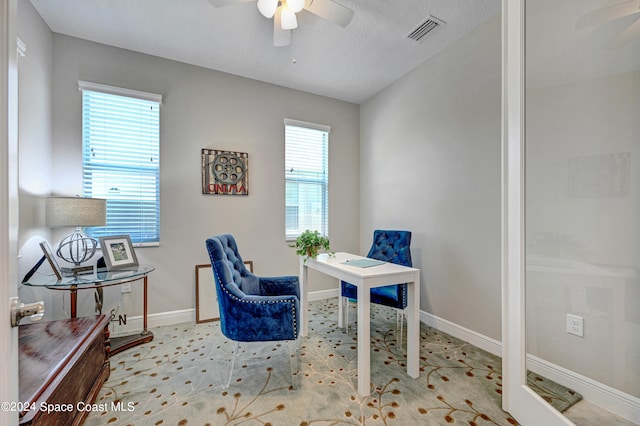 office area featuring ceiling fan, baseboards, visible vents, and a healthy amount of sunlight