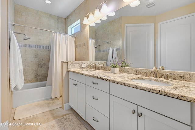 bathroom featuring shower / bath combination with curtain, vanity, and tile patterned floors