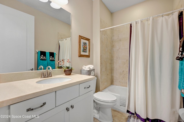 full bathroom with shower / bath combination with curtain, vanity, tile patterned flooring, and toilet