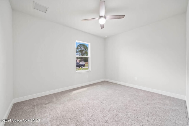 spare room featuring ceiling fan and carpet floors