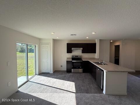 kitchen featuring stainless steel electric stove, black dishwasher, sink, kitchen peninsula, and a textured ceiling