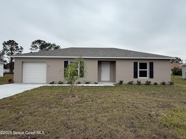 ranch-style home with a garage and a front yard