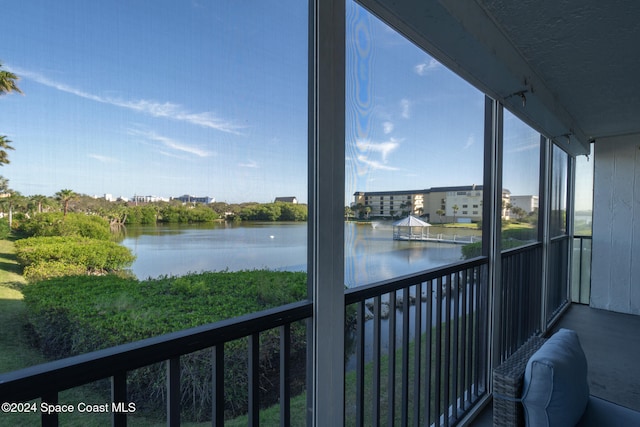 balcony featuring a water view