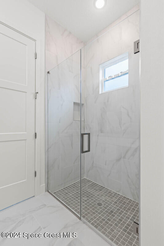 bathroom with an enclosed shower