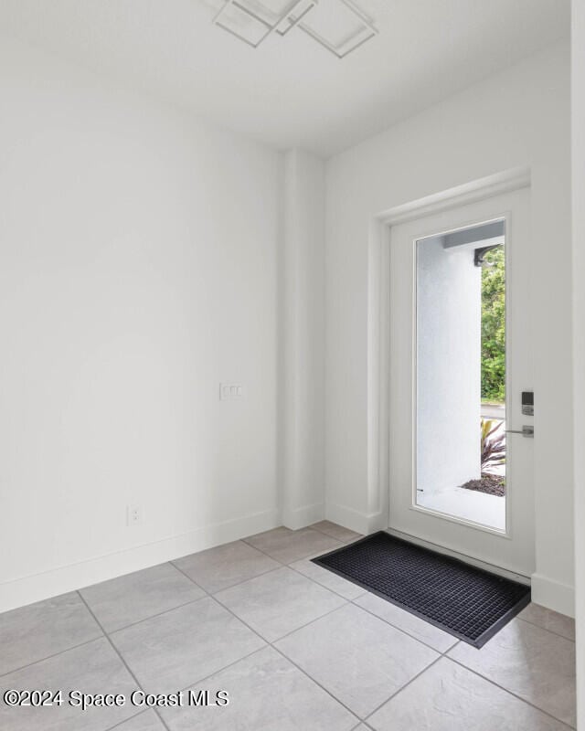 interior space featuring light tile patterned floors