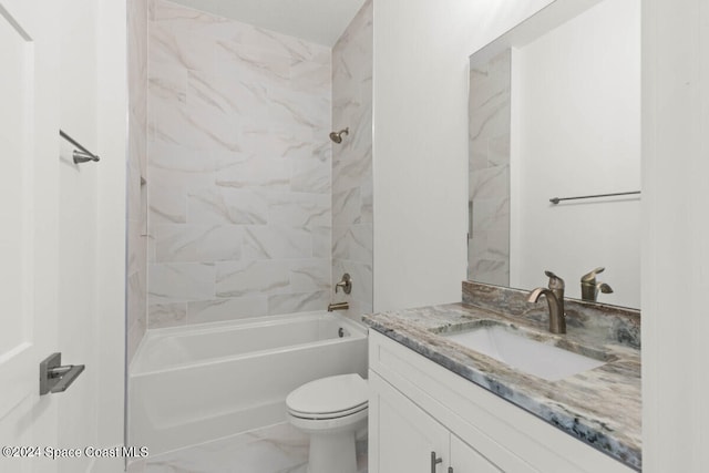 full bathroom featuring vanity, tiled shower / bath combo, and toilet