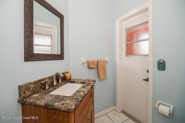 bathroom with vanity and tile patterned flooring