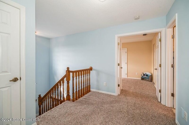 hallway with carpet