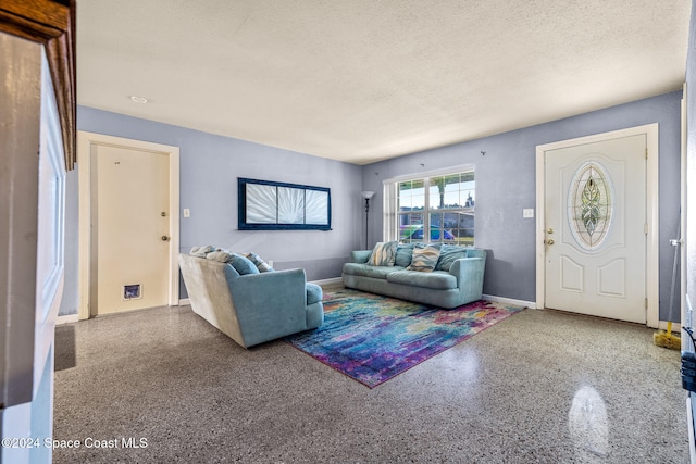 living room featuring a textured ceiling